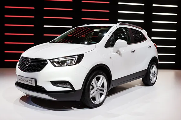 A white Opel Mokka on display during an auto show.